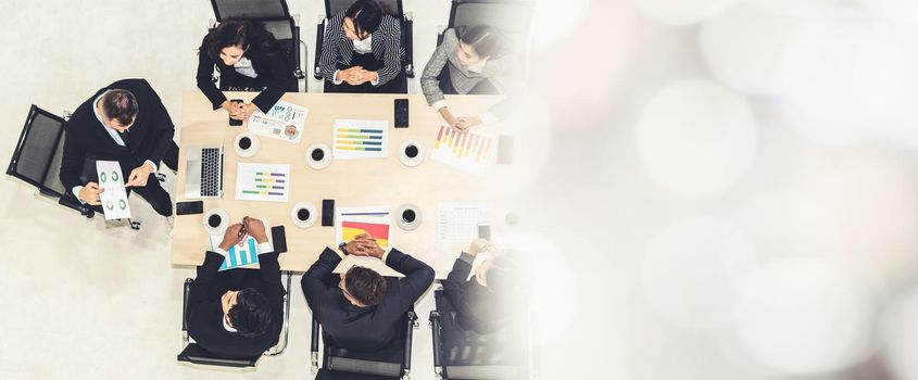 Business people group meeting shot from top view in office . Profession businesswomen, businessmen and office workers working in team conference with project planning document broaden view .