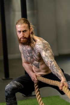 Rope man invisible was tug pull casual force power male, for handsome struggle from rivalry from pulling white, lifestyle fit. ABS activity professional, studio