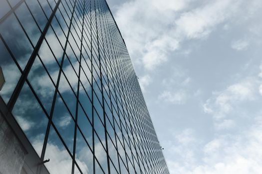 Genova, Italy-January 29, 2022: Beautiful modern high-rise buildings against the sky. 3d illustration on the theme of business success and technology. clouds reflection on the mirror.Industrial zone.