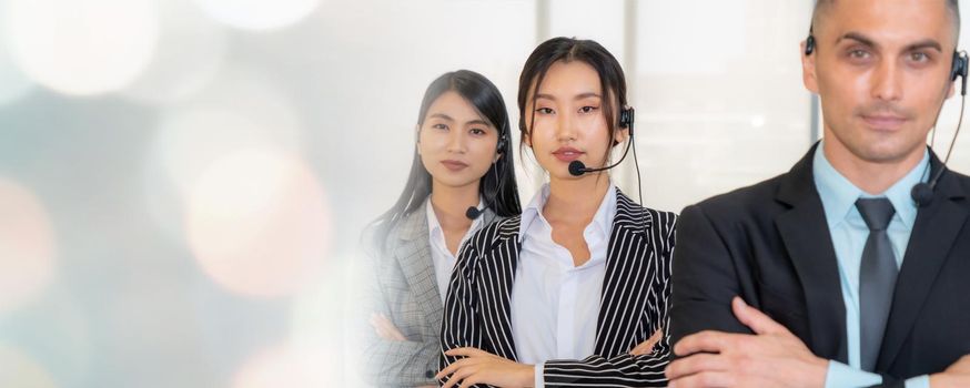 Business people wearing headset working in office to support remote customer or colleague. Call center, telemarketing, customer support agent provide service in broaden view .