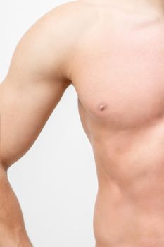 Half part torso of strong man with smooth skin isolated on white
