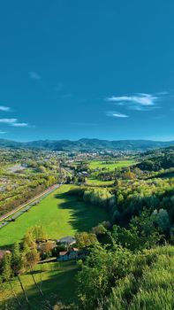 Genova, Italy - January 28, 2022: Park of Nervi by winter days. Green park for relax. Natural park near the sea, with some tall trees. Clear blue sky in the background.