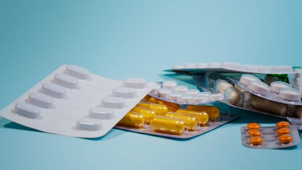 Medicine Pills On A Blue Background. close-up.