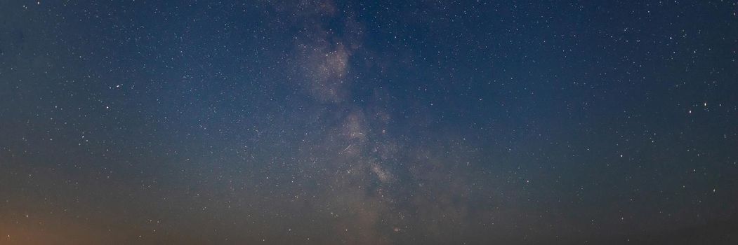 Close-up of starry night sky with milky way galaxy breathtaking view. Soft focus and noise due to high iso and long exposure. Nature, landscape concept