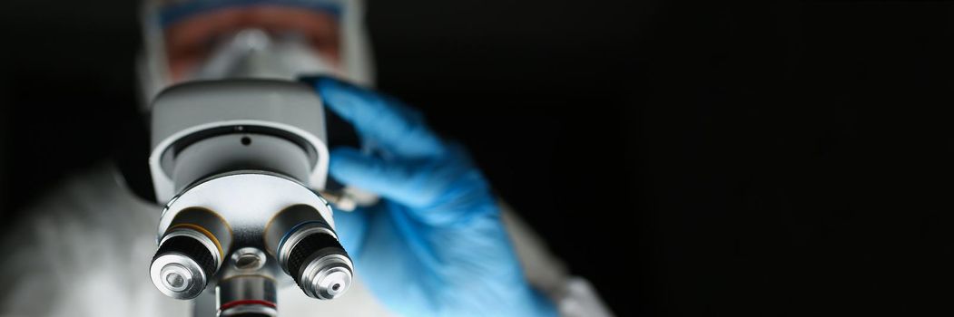 Close-up of professional scientist using equipment in modern laboratory while examining new chemical formula. Science, experiment, testing, lab concept