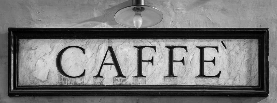 Rome, Italy. Tradiotional vintage style coffee sign on the wall.