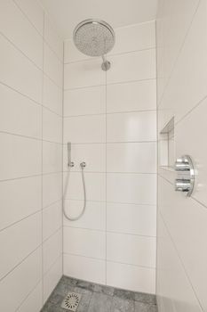 Interior of contemporary bathroom with shower and sink in minimal style in house