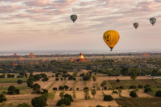 Aerial view of many hot air balloons and temples over the Bagan world heritage site in Myanmar