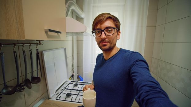 Point of view shot of man making online video call holding device with camera talking and gesturing looking at camera. Internet and communication concept. POV