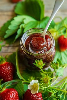 Homemade strawberry jam in a jar. Selective focus. Food.