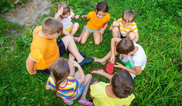 Children are playing with their hands clasped together. Selective focus. Kids.