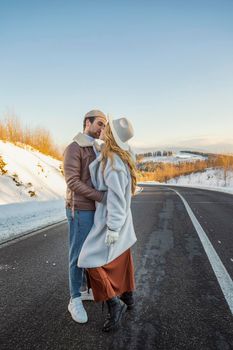 beautiful couple hugging on the road