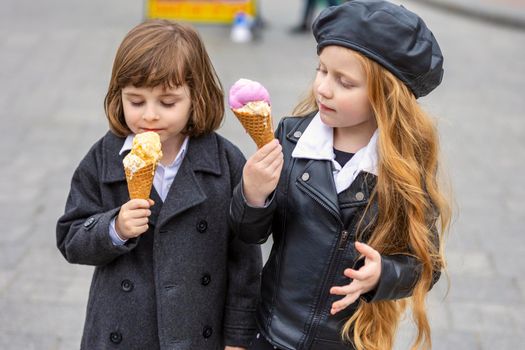 happy kids eating ice cream on the street