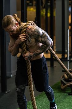 Rope man invisible was tug pull casual force power male, for handsome struggle from rivalry from pulling white, lifestyle fit. ABS activity professional, studio