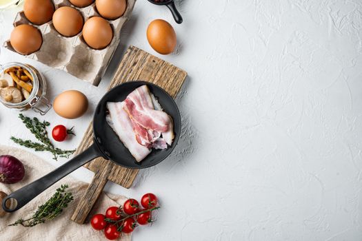 Healthy breakfast ingredients for fried eggs set, on white background, top view flat lay , with space for text copyspace