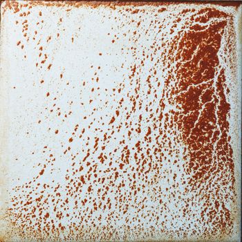 abstract wet rust scattering on a tile background