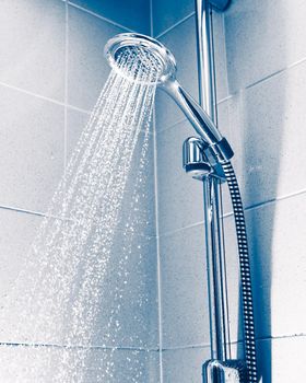 shower with water stream, blue background