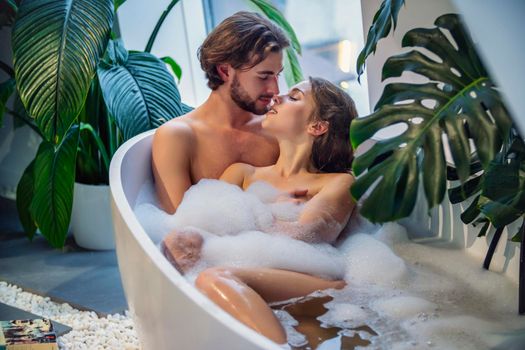 beautiful couple bathe in the bathroom