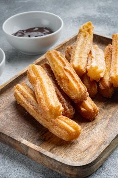 Churros with chocolate, Traditional Spanish cusine, on gray background