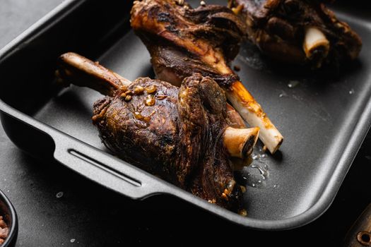 Baked lamb shank meat set, on gray stone table background