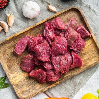 Beef chuck stew ingredients set, on gray stone background, top view flat lay