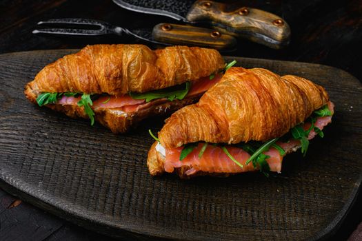 Sandwich with salted salmon set, on old dark wooden table background