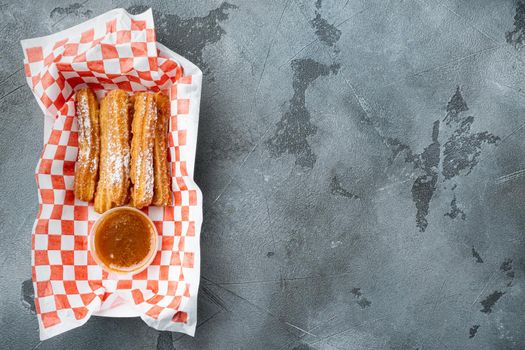 Fried Crullers in Brown, Take Away Bag in paper tray, on gray background, top view flat lay with space for text, copyspace