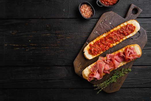 Healthy breakfast with homemade bread toast set, on black wooden table background, top view flat lay, with copy space for text