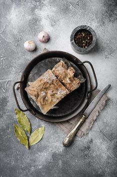 Jellied meat set, on gray stone table background, top view flat lay, with copy space for text