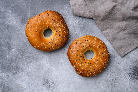 Bagel Freshly Baked, on gray stone table background, top view flat lay, with copy space for text