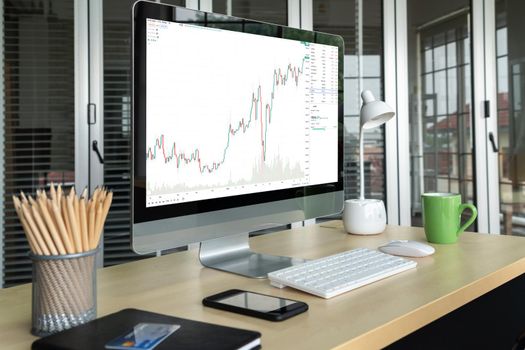 Stock market data chart analysis by ingenious computer software . Investment application display stock market chart on the computer screen and advise trading decision .