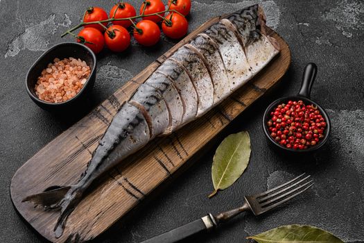 Delicious Braised Mackerel set, on black dark stone table background