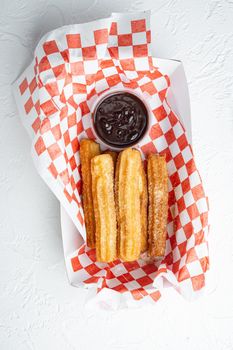 Fried Crullers in Brown, Take Away Bag in paper tray, on white background, top view flat lay