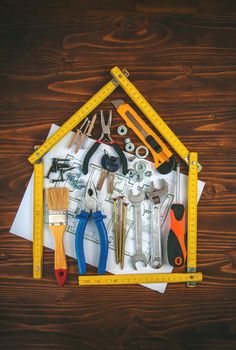 Repair work of a house with tools. Selective focus. plan