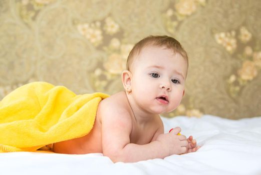 Baby after bathing in a towel. Selective focus. Child.