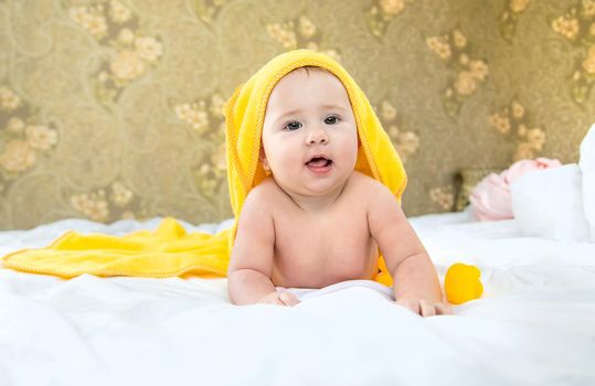 Baby after bathing in a towel. Selective focus. Child.