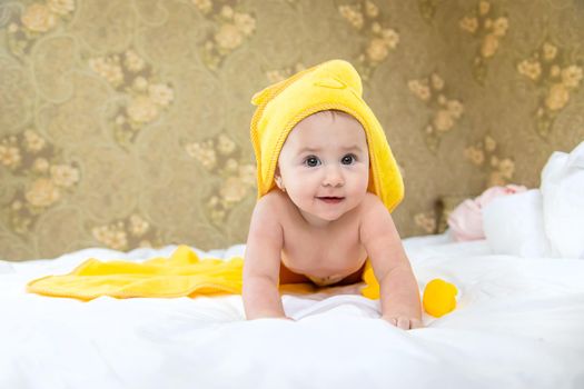 Baby after bathing in a towel. Selective focus. Child.