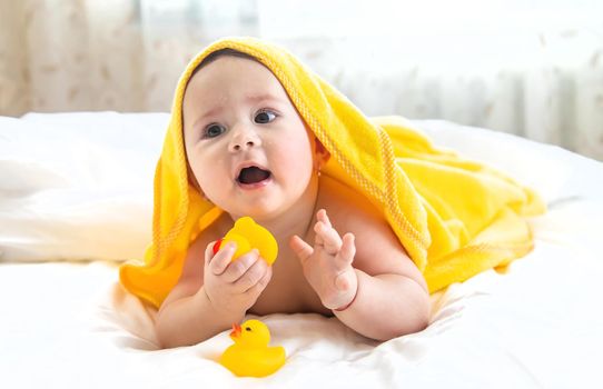 Baby after bathing in a towel. Selective focus. Child.