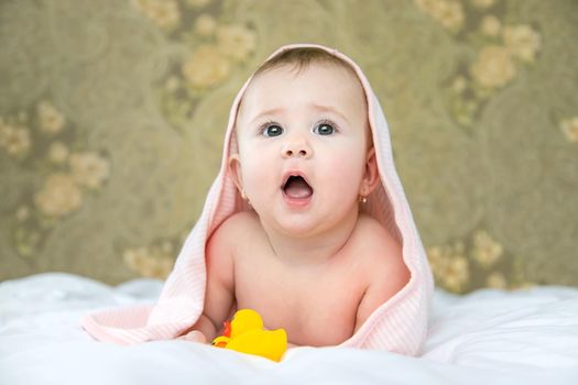 Baby after bathing in a towel. Selective focus. Child.