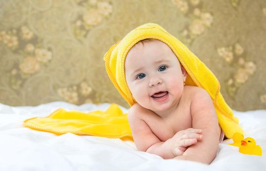 Baby after bathing in a towel. Selective focus. Child.