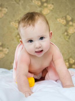 Baby after bathing in a towel. Selective focus. Child.