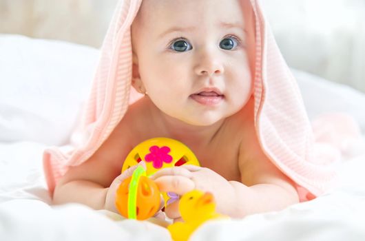 Baby after bathing in a towel. Selective focus. Child.