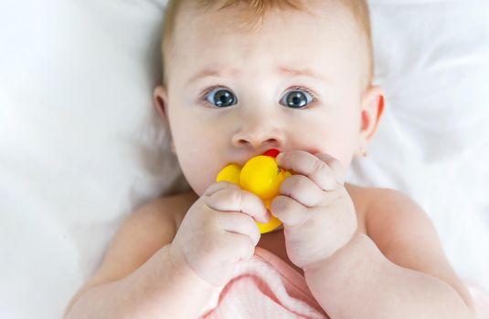 Baby after bathing in a towel. Selective focus. Child.