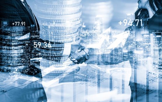 Business handshake on finance prosperity and money technology asset background . Economy and financial growth by investment in valuable stock market to gain wealth profit form currency trading