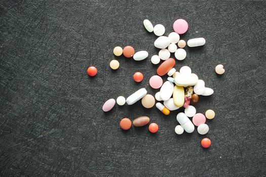 selective focus. Close up of many colorful pills and capsules .