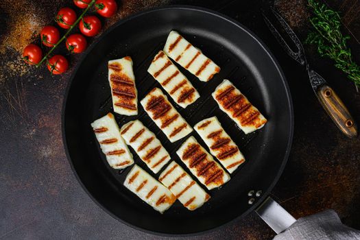 Halloumi fried cheese set, on old dark rustic table background, top view flat lay