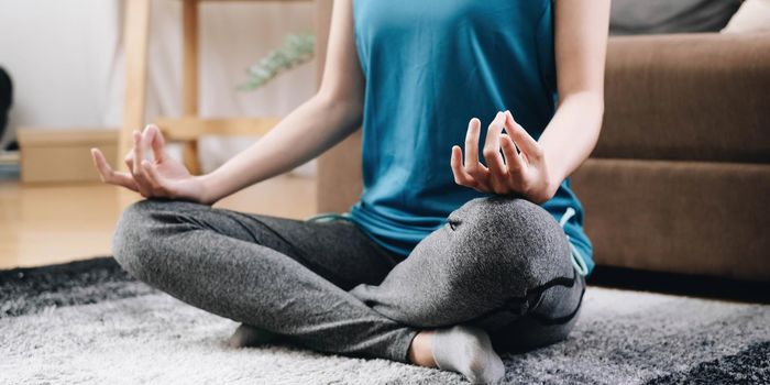 Class of yoga with meditate hands of Asia woman doing meditation Healthcare, lifestyle concept.National Physical Fitness and Sports Month. National Yoga Awareness Month