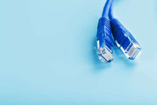 Blue UTP Internet Cable - Isolated on a blue background Ethernet Cord