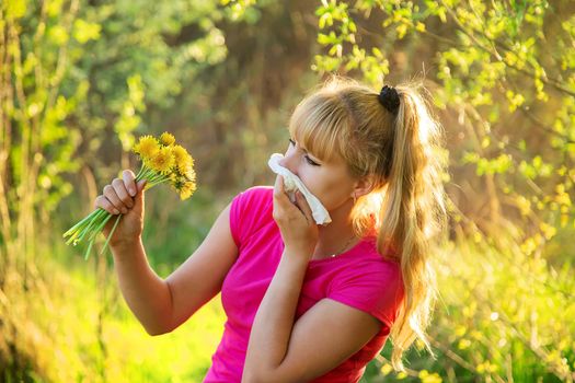 The woman is allergic to flowers. Selective focus. nature