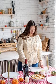 Happy Thanksgiving Day. Autumn feast. Woman celebrating holiday cooking traditional dinner at kitchen